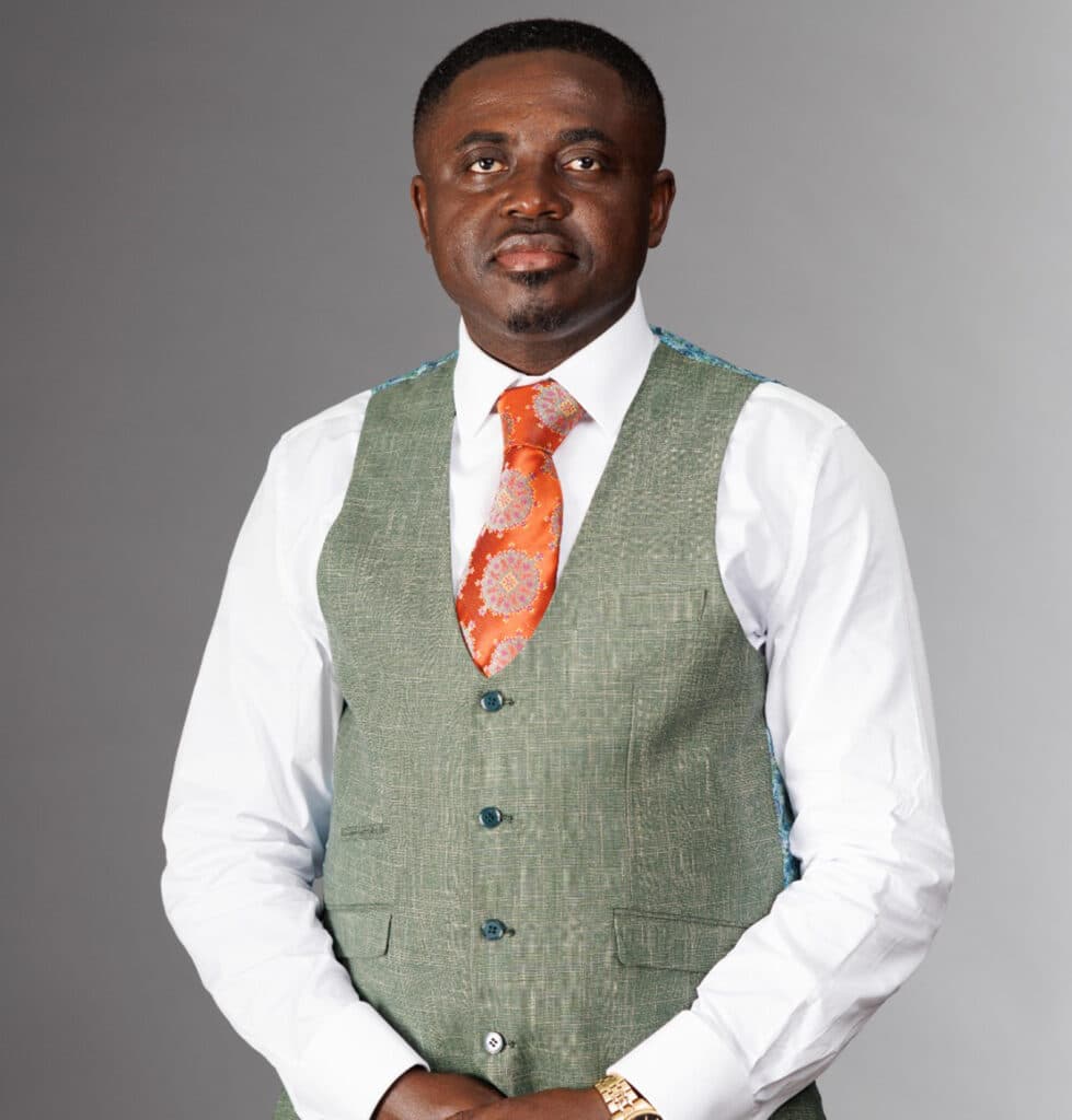 Reverend Prince Oppong Adjei in a green waistcoat