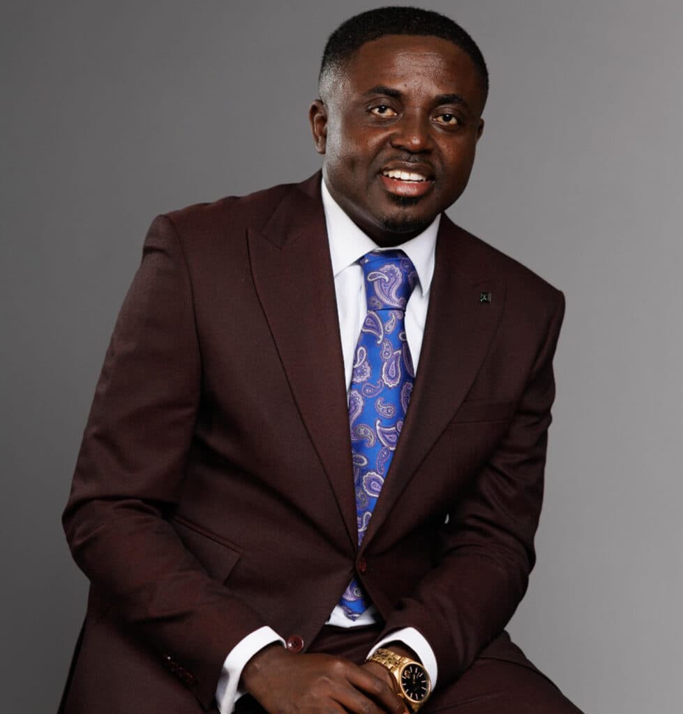 Reverend Prince Oppong Adjei in a burgundy suit